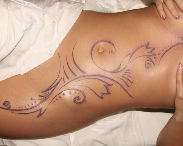 stomach tattoo designs. beautiful tattoo designs in