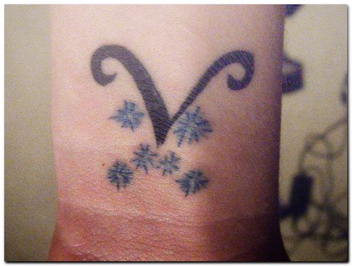 Most aries tattoo designs symbol are large and colorful 