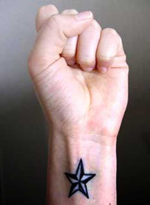 Black nautical star tattoo
